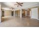 Large basement featuring neutral paint, tile flooring, ceiling fans, and ample room for storage at 7631 Sailwinds Pass, Port Richey, FL 34668