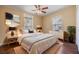 Stylish bedroom with a comfortable bed, nightstands with lamps, and a dresser at 7631 Sailwinds Pass, Port Richey, FL 34668
