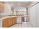 Open kitchen area featuring light wood cabinets and access to living areas at 7631 Sailwinds Pass, Port Richey, FL 34668