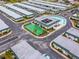 Aerial view of the community amenities, including a pool, clubhouse and shuffleboard at 7816 38Th N Ter # 7816, St Petersburg, FL 33709