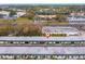 Aerial view of the building, road, and surrounding buildings and greenery at 7816 38Th N Ter # 7816, St Petersburg, FL 33709
