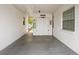 Spacious carport area with ample storage and access to the home's side entrance at 7816 38Th N Ter # 7816, St Petersburg, FL 33709