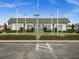 Clubhouse for Tyrone Villas has manicured landscaping, benches and a shuffleboard court at 7816 38Th N Ter # 7816, St Petersburg, FL 33709