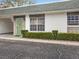 Inviting single-story home with a manicured hedge and convenient covered parking at 7816 38Th N Ter # 7816, St Petersburg, FL 33709