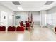 Light meeting room with table and chairs plus view of flags and beach painting at 7816 38Th N Ter # 7816, St Petersburg, FL 33709