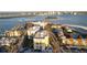 Birds eye view of condos, roadways, palm trees, and waterway in Clearwater Point at 830 S Gulfview Blvd # 501, Clearwater Beach, FL 33767