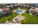 Aerial view of community amenities, including a pool, grill, and seating at 830 S Gulfview Blvd # 501, Clearwater Beach, FL 33767