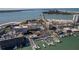 Gorgeous aerial view of waterfront condos, boat docks, beach, and scenic bridge in Clearwater Point at 830 S Gulfview Blvd # 501, Clearwater Beach, FL 33767
