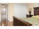 Bright bedroom features hardwood floors, a closet, and a bathroom with a shower in the background at 830 S Gulfview Blvd # 501, Clearwater Beach, FL 33767