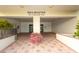 Sailmaster building entrance with covered entryway, tile floor, and manicured landscaping at 830 S Gulfview Blvd # 501, Clearwater Beach, FL 33767