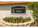 Close up of the Clearwater Point community sign with flowers and stone pavers in foreground at 830 S Gulfview Blvd # 501, Clearwater Beach, FL 33767