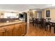 Inviting dining area with hardwood floors, adjacent to the living area with a built-in media center at 830 S Gulfview Blvd # 501, Clearwater Beach, FL 33767