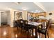 Dining room with hardwood floors, table, and stainless-steel kitchen appliances in view at 830 S Gulfview Blvd # 501, Clearwater Beach, FL 33767