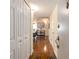 Inviting hallway with hardwood floors leading into a dining and living space at 830 S Gulfview Blvd # 501, Clearwater Beach, FL 33767
