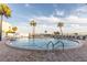 Luxury community pool boasts seating, tropical landscaping, and beautiful waterfront views at 830 S Gulfview Blvd # 501, Clearwater Beach, FL 33767