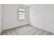 Bedroom features plush carpet with a sunny window at 9412 Coastline Way, Parrish, FL 34219