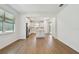 Spacious open-plan living space with sleek floors connecting to the kitchen and dining areas, and natural lighting at 9412 Coastline Way, Parrish, FL 34219