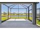 Screened in patio overlooking a lake view at 9412 Coastline Way, Parrish, FL 34219