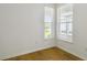 Bright bedroom with hardwood floors and two windows offering natural light at 9466 Shorebird Ct, Parrish, FL 34219