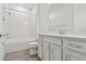Bathroom features a tub, a toilet, a vanity, and a shower head at 9470 Shorebird Ct, Parrish, FL 34219