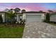 Charming single-Gathering home with a two-car garage and manicured front yard at 9470 Shorebird Ct, Parrish, FL 34219