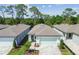 Aerial view of a house with a well-manicured lawn and landscaping at 9470 Shorebird Ct, Parrish, FL 34219