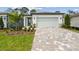 Charming single-story home with well-manicured landscaping and a brick paved driveway at 9470 Shorebird Ct, Parrish, FL 34219