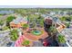 Aerial view of commercial center with lush palms, decorative fountain and surrounding buildings at 10620 Tavistock Dr, Tampa, FL 33626