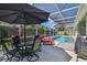 Screened in pool deck with seating and full size swimming pool, great for outdoor relaxation and entertainment at 10620 Tavistock Dr, Tampa, FL 33626