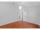 Bedroom featuring laminate floors, a decorative chandelier, and an open door at 11917 Middlebury Dr, Tampa, FL 33626