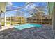 Screened-in pool with brick patio, offering a private outdoor retreat at 11917 Middlebury Dr, Tampa, FL 33626