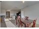 Open concept view of the dining room, kitchen island, and living room with great natural light at 12029 Gillingham Harbor Ln, Gibsonton, FL 33534