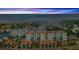 Scenic aerial shot featuring a condominium complex near the water at sunset, showcasing coastal living at 1325 Snell Isle Ne Blvd # 611, St Petersburg, FL 33704