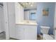 Bright bathroom features a single vanity, white cabinets, and tiled flooring at 1325 Snell Isle Ne Blvd # 611, St Petersburg, FL 33704