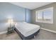 Bright bedroom features carpet flooring, a large window, and a comfortable queen sized bed at 1325 Snell Isle Ne Blvd # 611, St Petersburg, FL 33704