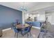 Bright dining area with a stylish blue accent wall and a modern chandelier at 1325 Snell Isle Ne Blvd # 611, St Petersburg, FL 33704