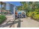 This shows the kayak storage racks with kayaks and paddleboards in a community near the beach and tropical trees at 1325 Snell Isle Ne Blvd # 611, St Petersburg, FL 33704