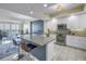 Open-concept kitchen with an island, stainless steel appliances and easy access to the living area at 1325 Snell Isle Ne Blvd # 611, St Petersburg, FL 33704