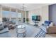 Comfortable living area with a view of the outdoor balcony and waterfront at 1325 Snell Isle Ne Blvd # 611, St Petersburg, FL 33704