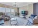 Living room featuring a large sliding glass door to the balcony with beautiful ocean views at 1325 Snell Isle Ne Blvd # 611, St Petersburg, FL 33704