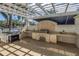 Outdoor kitchen with built-in grill, countertops, and overhead pergola for shade at 1325 Snell Isle Ne Blvd # 611, St Petersburg, FL 33704