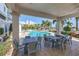 Covered patio seating area with pool view, tables and comfortable chairs at 1325 Snell Isle Ne Blvd # 611, St Petersburg, FL 33704