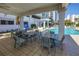 Outdoor patio area featuring dining tables and chairs with pool access at 1325 Snell Isle Ne Blvd # 611, St Petersburg, FL 33704