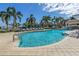 Resort-style pool area with lounge chairs, palm trees, and views of the marina at 1325 Snell Isle Ne Blvd # 611, St Petersburg, FL 33704