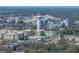 An aerial view of the neighborhood displaying the water tower, buildings, and serene surroundings at 13385 Arbor Pointe Cir # 203, Tampa, FL 33617