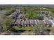 Aerial view featuring condo building, landscaping, and a view overlooking a canal in the rear at 13385 Arbor Pointe Cir # 203, Tampa, FL 33617