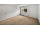 Cozy bedroom featuring neutral carpet, a window providing natural light, and a closet at 13385 Arbor Pointe Cir # 203, Tampa, FL 33617