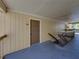 Exterior view of condo with a door and railing overlooking trees and vegetation at 13385 Arbor Pointe Cir # 203, Tampa, FL 33617