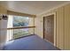 Exterior view of condo with a door and railing overlooking trees and vegetation at 13385 Arbor Pointe Cir # 203, Tampa, FL 33617