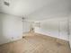 Bright living room featuring neutral carpet and white walls, creating a blank canvas for personalization at 13385 Arbor Pointe Cir # 203, Tampa, FL 33617